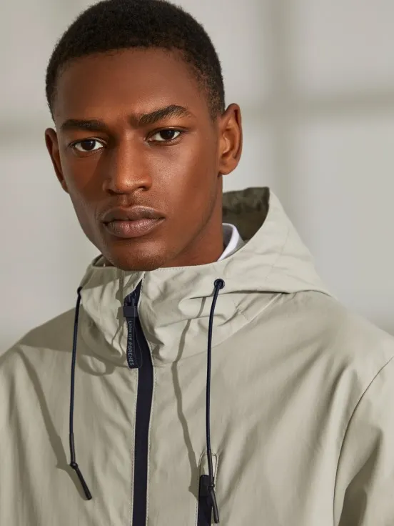 Man's parka in technical fabric with hood and pockets