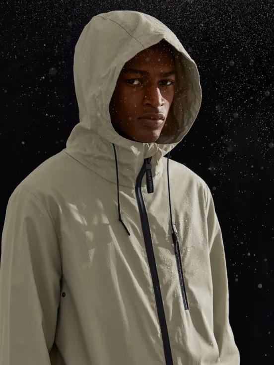 Man's parka in technical fabric with hood and pockets